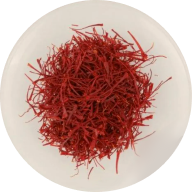 Red dried saffron on a white plate